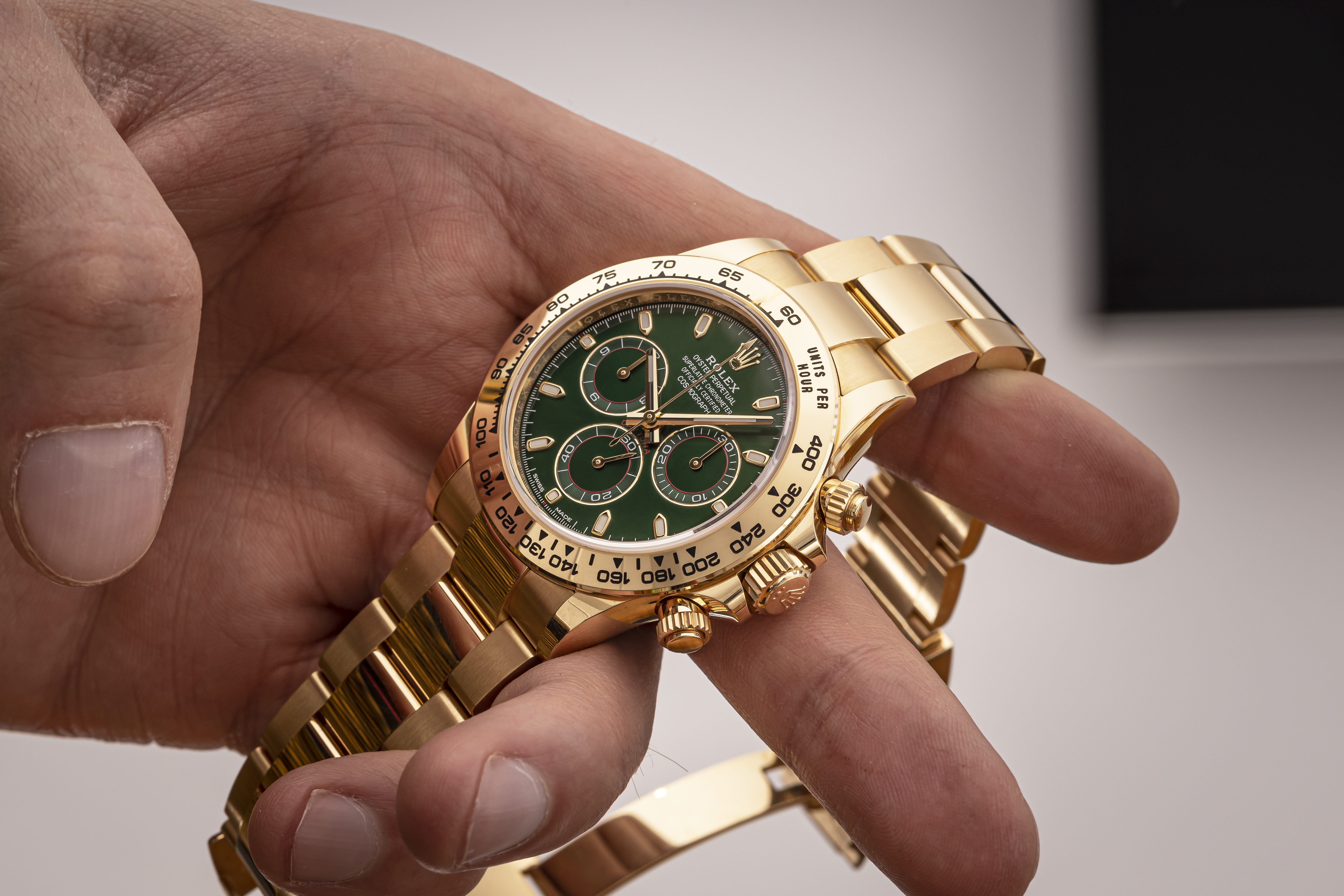 2020 ROLEX DAYTONA YELLOW GOLD WITH GREEN DIAL for sale by auction